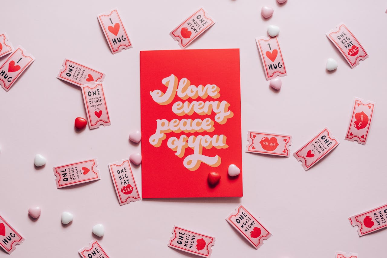 A romantic card with love tokens on a pink background, perfect for Valentine's Day.